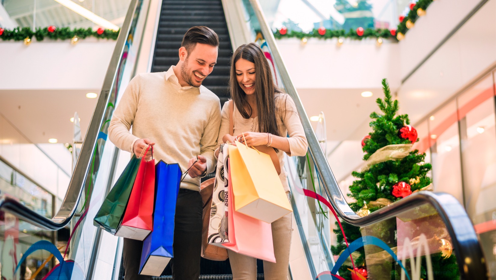 loving-couple-doing-christmas-shopping-together-picture-id500110954