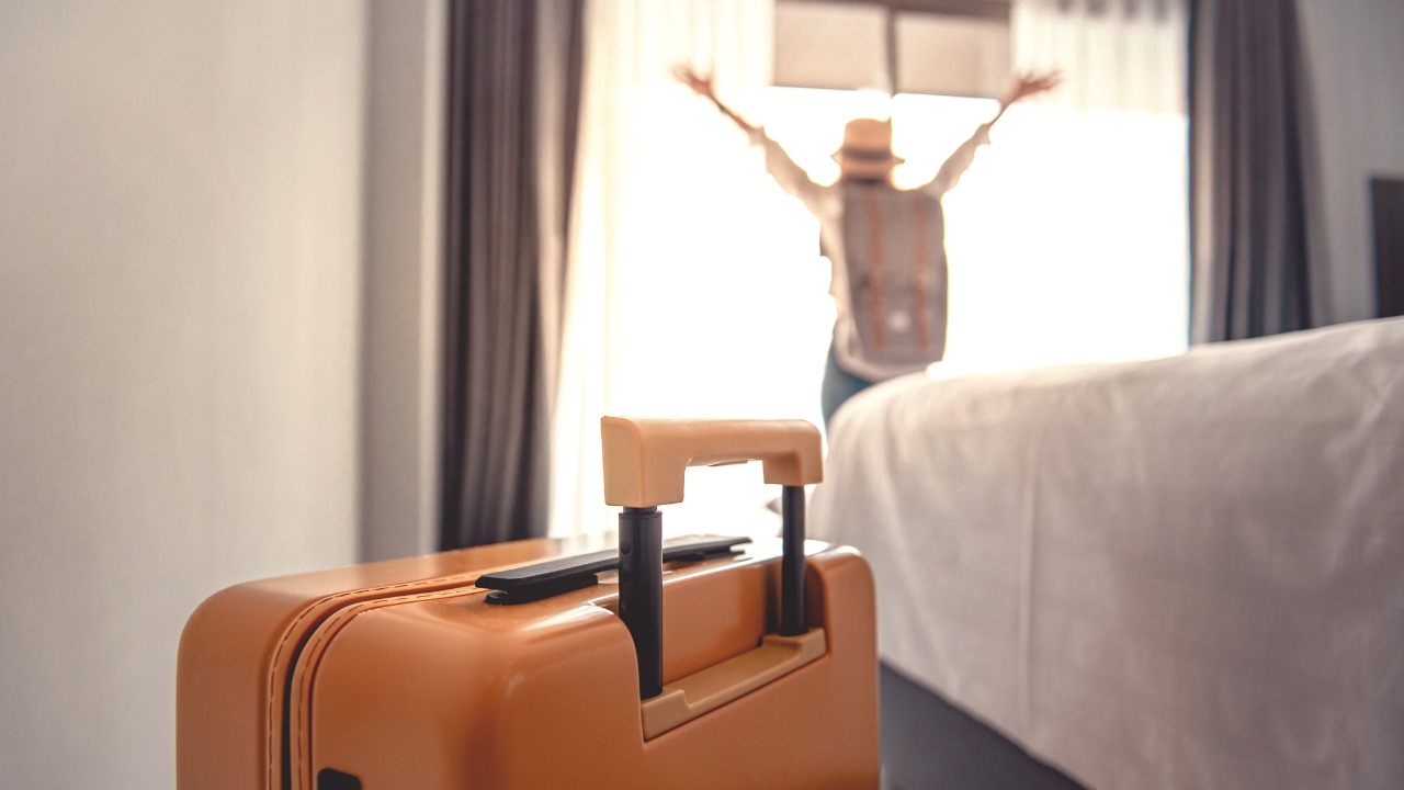 luggage-and-blurred-happy-tourist-woman-background-in-hotel-after-check-in-conceptual-of.jpg_s=1024x1024&w=is&k=20&c=zB1_z_5eYWHY5AVrg8POAXeuqGLOR45nV6A_LngpsqQ=