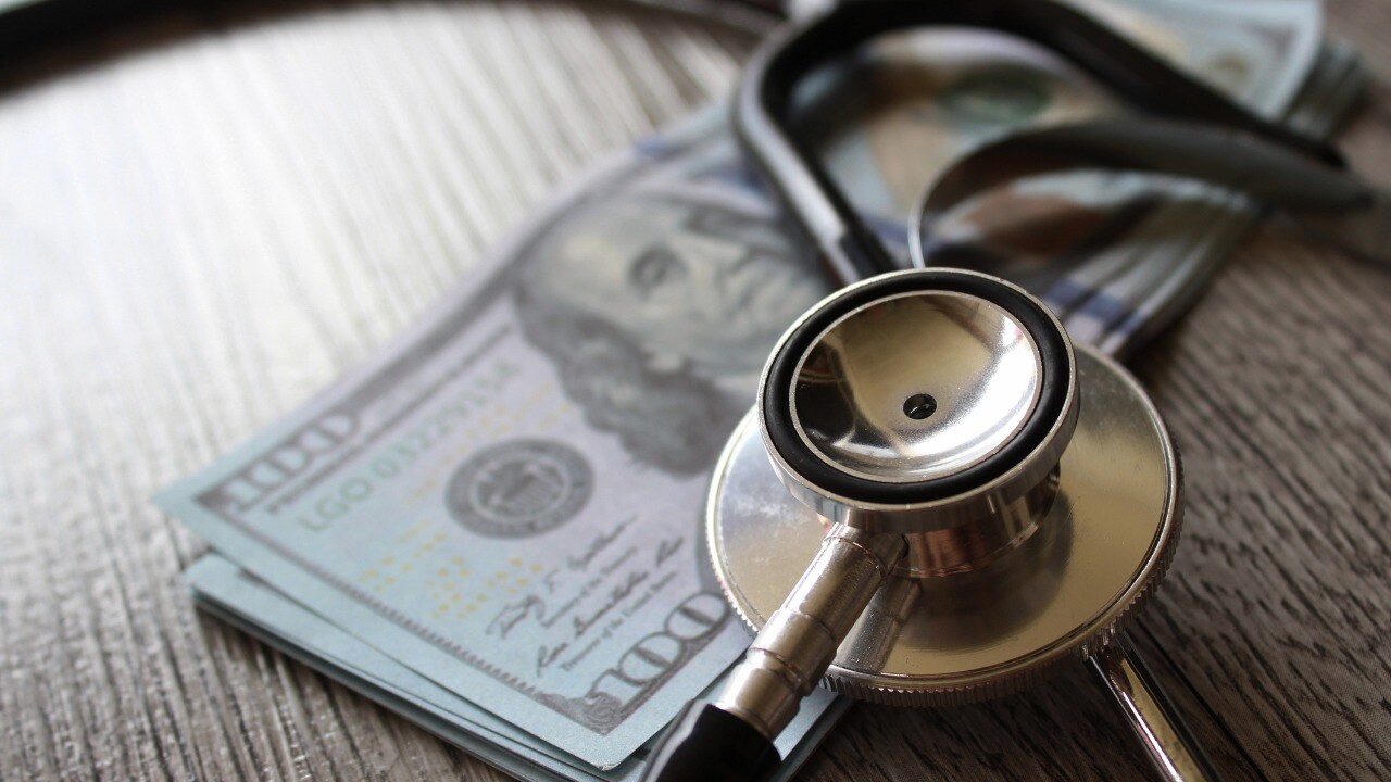 stethoscope-and-money-on-wooden-table.jpg_s=1024x1024&w=is&k=20&c=bJMjarvVMR7vxfvYTjLO8AZpCvPQVU8hV-QC1Q-RHxE=