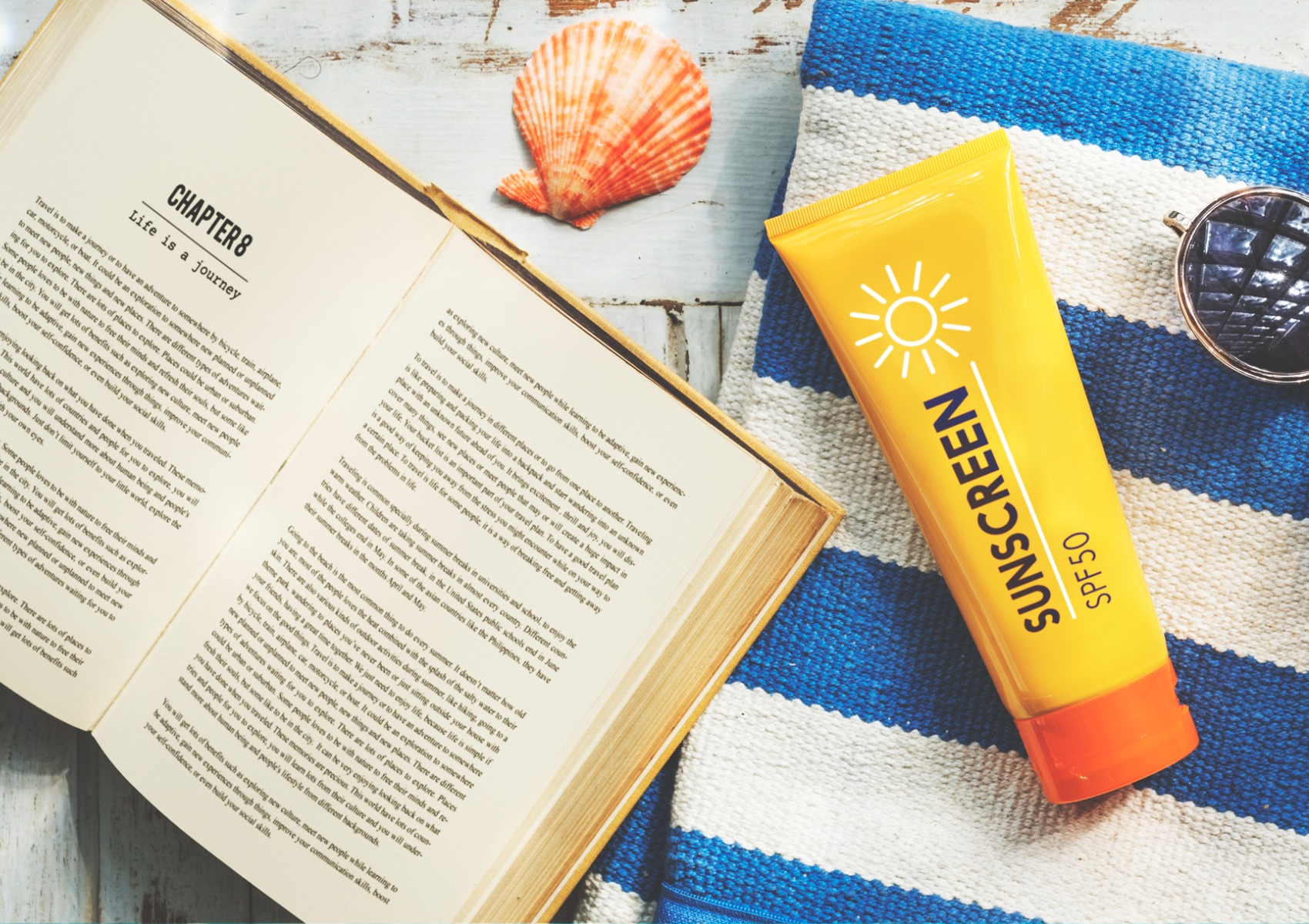 sunscreen-sunglasses-towel-book-recess-relax-concept-picture-id621712484